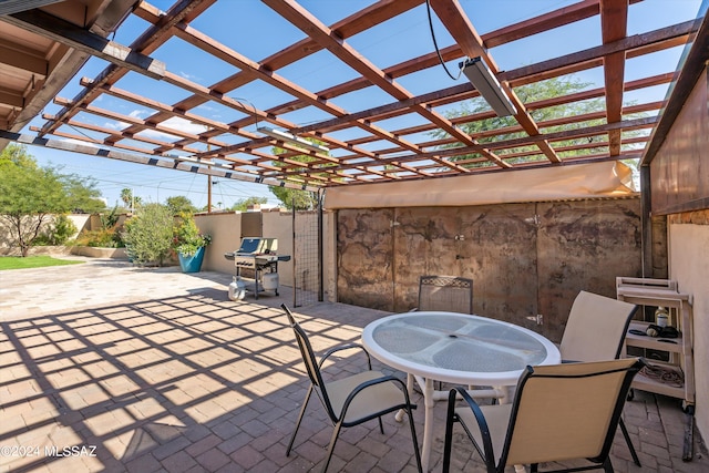 view of patio with a pergola and a grill