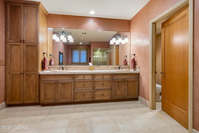 bathroom with toilet and vanity