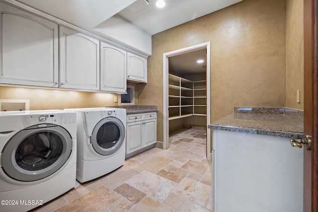 laundry area featuring cabinets and independent washer and dryer