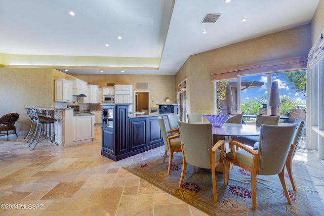 dining area with a high ceiling