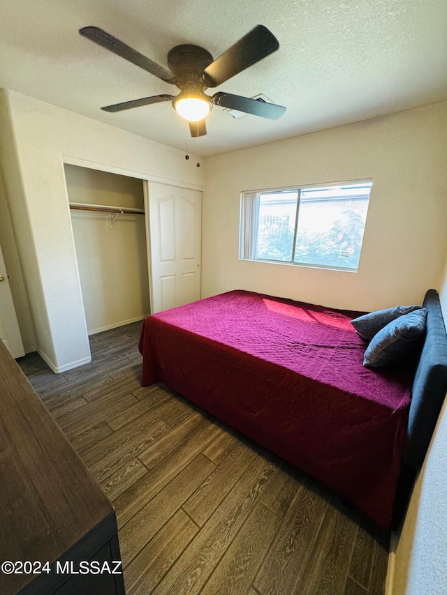 bedroom with a closet, ceiling fan, and hardwood / wood-style floors