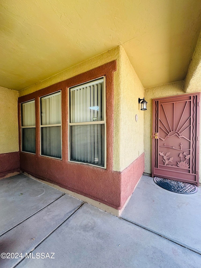 doorway to property featuring a patio area