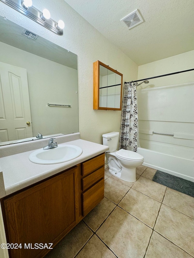 full bathroom with tile patterned flooring, toilet, shower / tub combo with curtain, and vanity