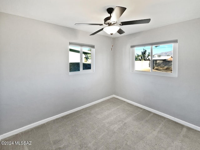 carpeted empty room with ceiling fan