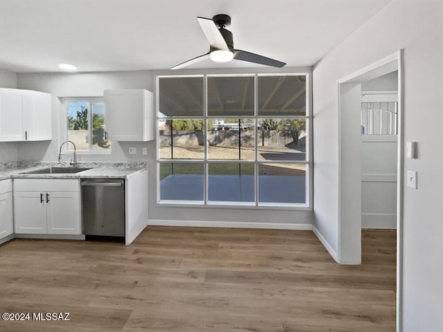 kitchen with dishwasher, white cabinets, sink, ceiling fan, and light hardwood / wood-style floors