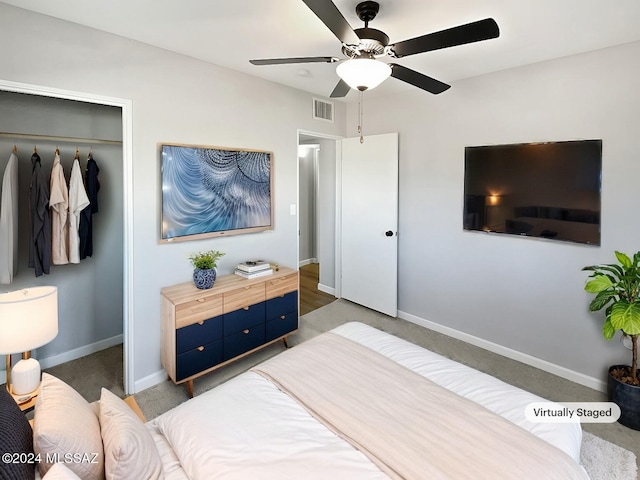 bedroom with ceiling fan, a closet, and dark carpet