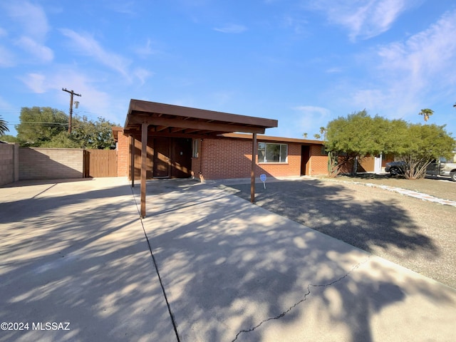 single story home with a carport