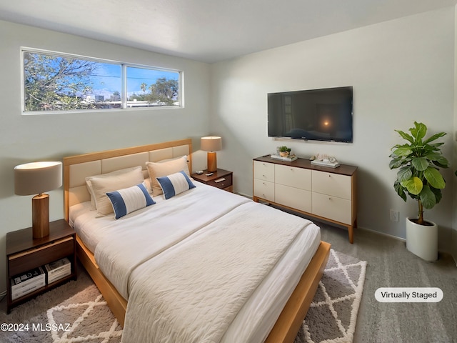 bedroom featuring a closet and carpet flooring