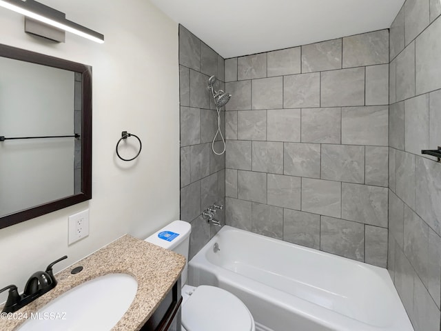 full bathroom featuring toilet, vanity, tiled shower / bath, and hardwood / wood-style flooring