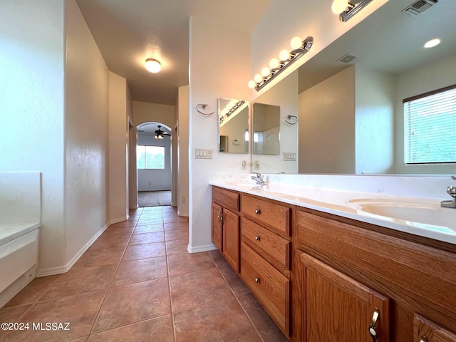 full bathroom with tile patterned floors, visible vents, double vanity, and a sink
