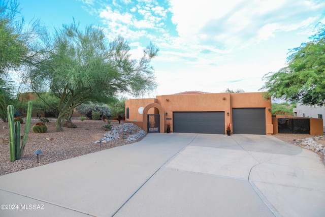 southwest-style home featuring a garage