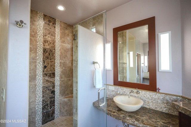 bathroom with sink and an enclosed shower