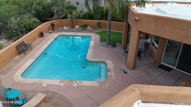 view of swimming pool with a patio