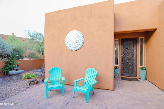 doorway to property with a patio area