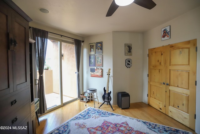 bedroom with ceiling fan, light hardwood / wood-style flooring, and access to outside