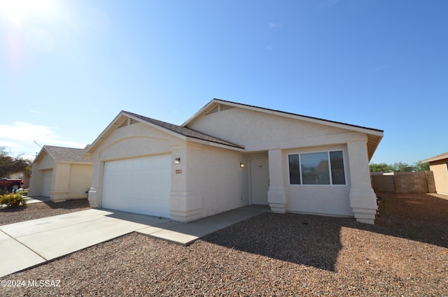 ranch-style house featuring a garage