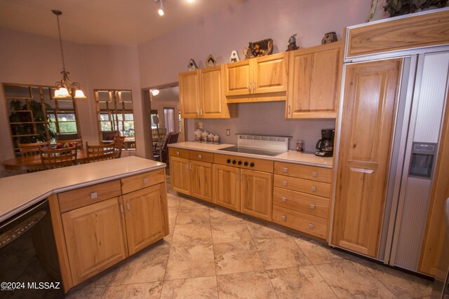 kitchen with a chandelier, decorative light fixtures, black appliances, and light tile patterned floors