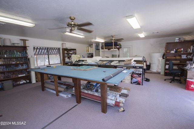 recreation room with carpet flooring and ceiling fan