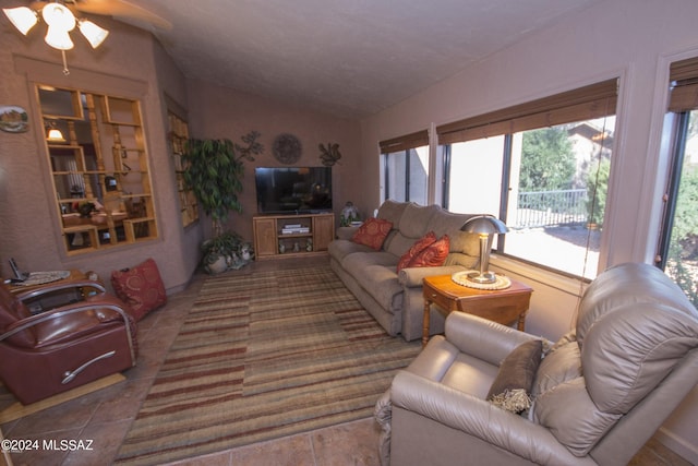 living room featuring tile patterned flooring and ceiling fan