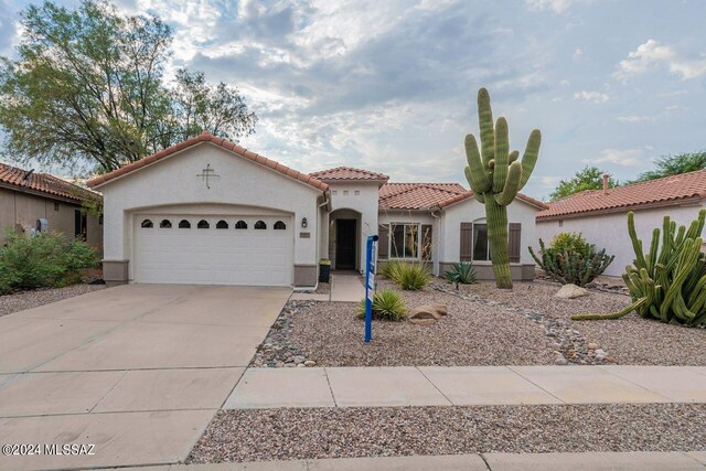 mediterranean / spanish-style house featuring a garage