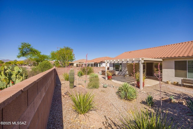 view of yard featuring a fenced backyard, a patio area, and a pergola