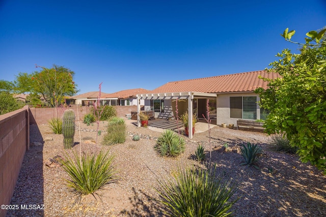 back of property featuring a pergola, a patio, a fenced backyard, stucco siding, and a tile roof