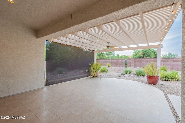 view of patio / terrace with ceiling fan and a pergola