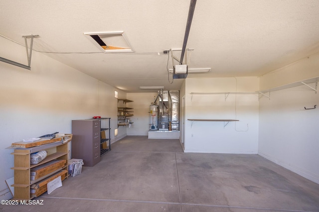 garage with baseboards, strapped water heater, and a garage door opener