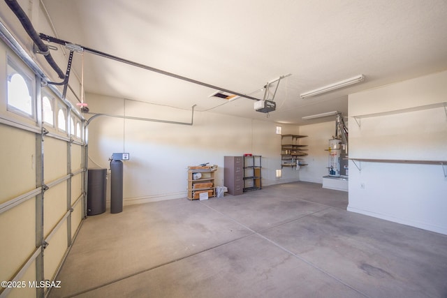garage with water heater, baseboards, and a garage door opener