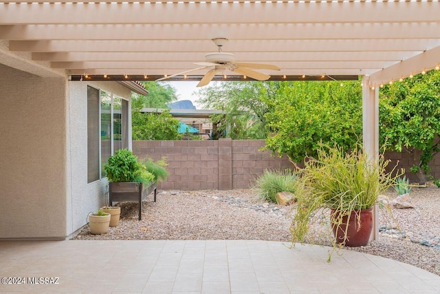 view of patio featuring a pergola and ceiling fan