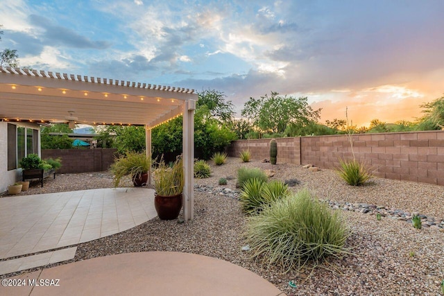 patio terrace at dusk with a pergola