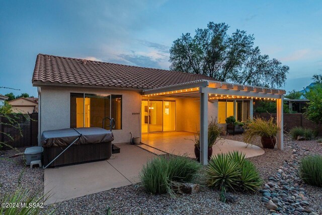 yard at dusk with a patio and a pergola