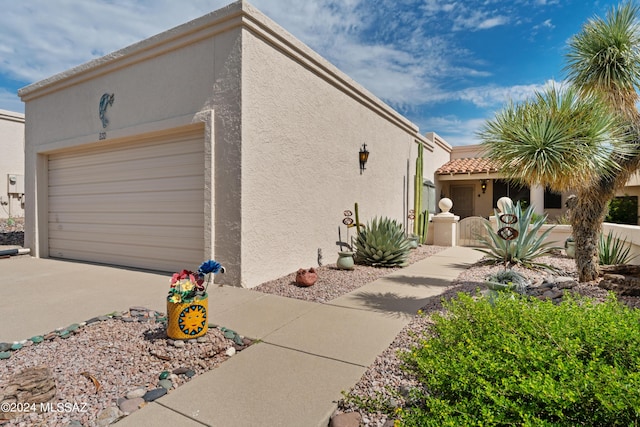 view of side of home featuring a garage