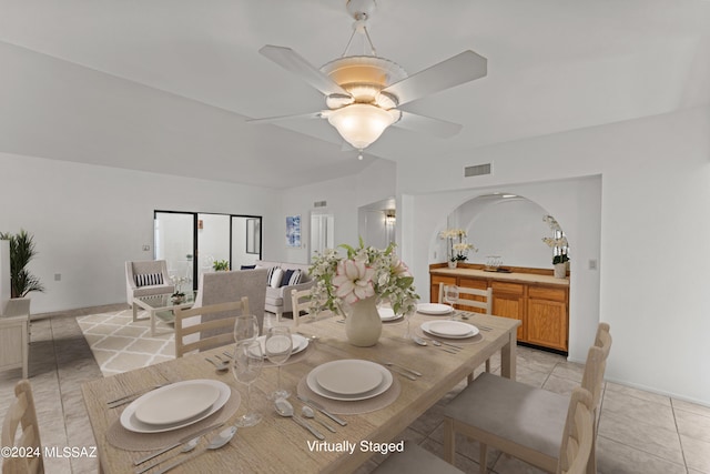 tiled dining room featuring ceiling fan