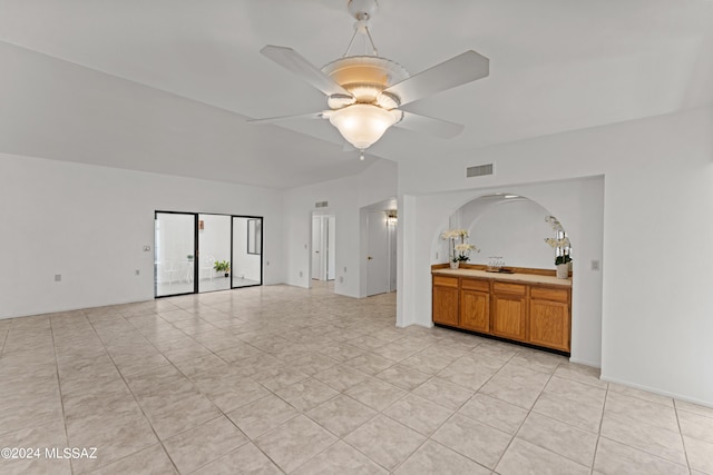 unfurnished living room featuring ceiling fan