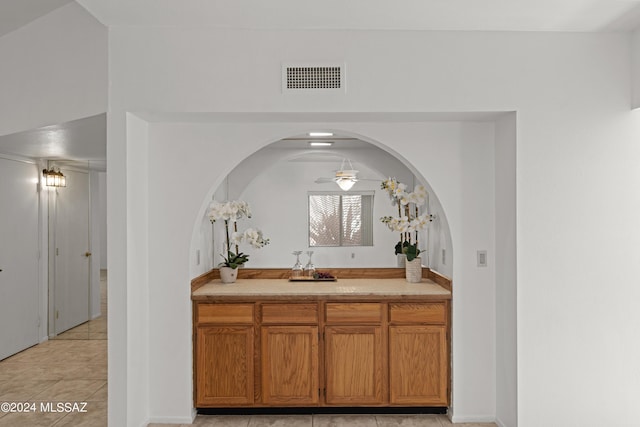 bathroom featuring ceiling fan, vanity, and tile patterned floors