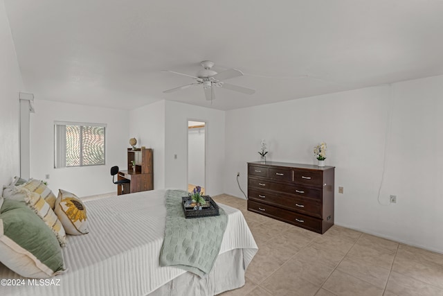 tiled bedroom with ceiling fan