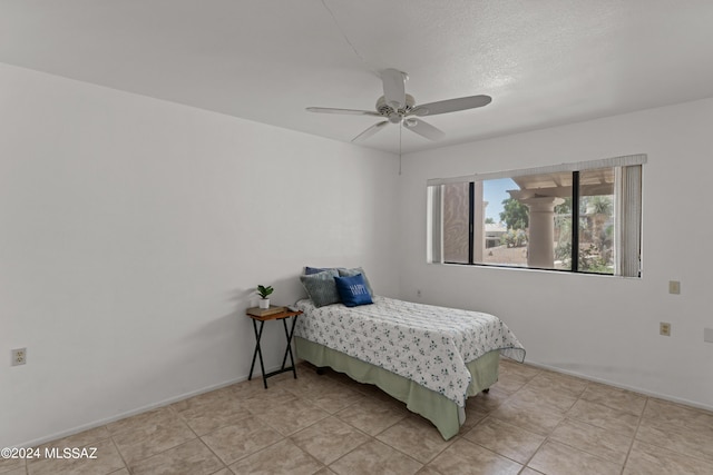 bedroom featuring light tile patterned flooring and ceiling fan