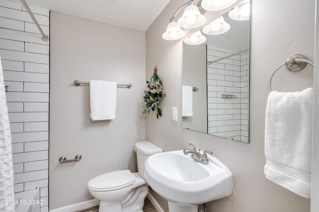 bathroom with toilet and sink