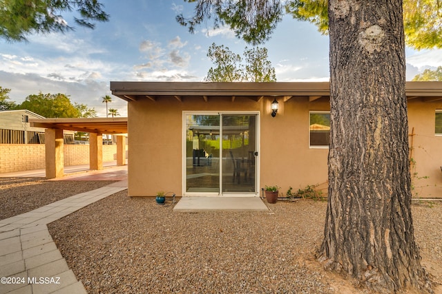 rear view of house with a carport