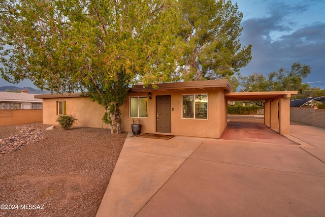 view of front of house with a carport