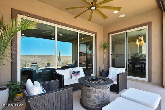 view of patio featuring an outdoor living space with a fire pit and ceiling fan