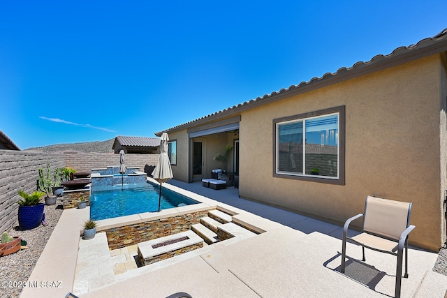 view of swimming pool with a fenced in pool, a patio, and a fenced backyard