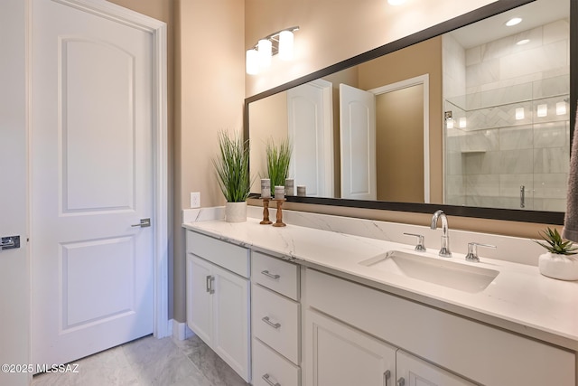 full bath featuring a stall shower and vanity