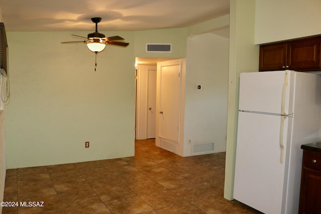 kitchen with white refrigerator, tile patterned floors, and ceiling fan