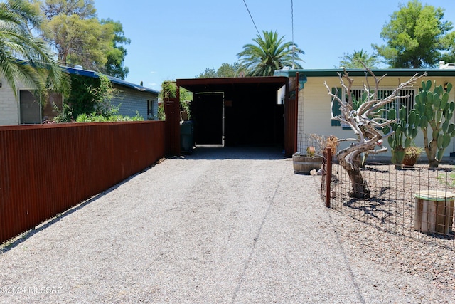 garage featuring a carport