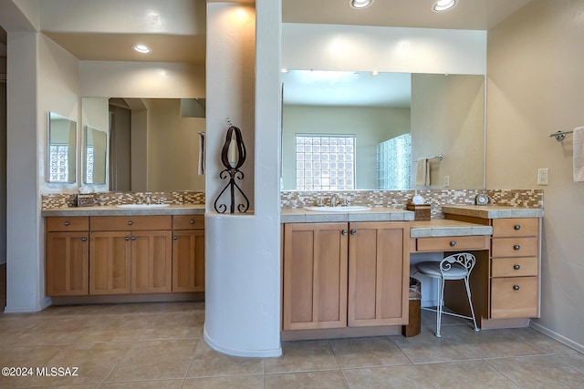 bathroom featuring tasteful backsplash, vanity, and tile patterned floors