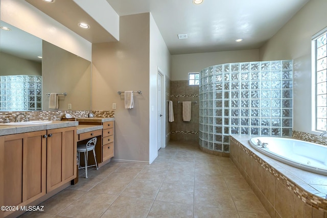 bathroom featuring tile patterned flooring, decorative backsplash, a wealth of natural light, and plus walk in shower