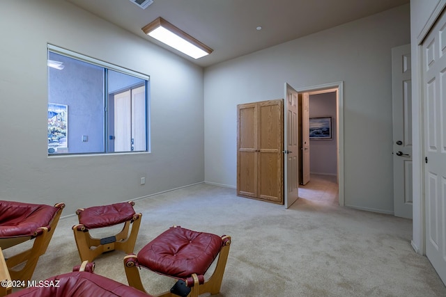 living area with light colored carpet