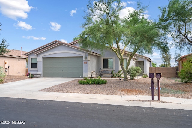 ranch-style house featuring a garage